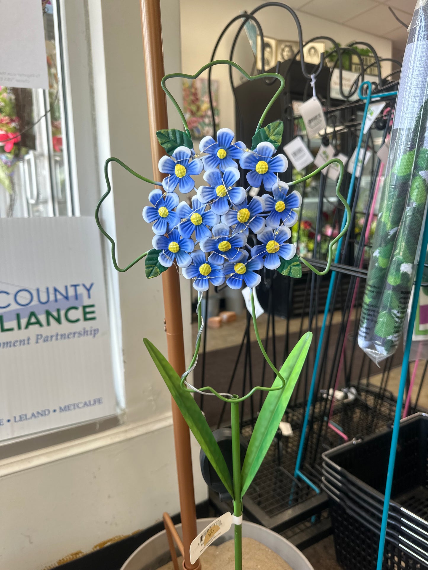 Evergreen flower cross outside stand