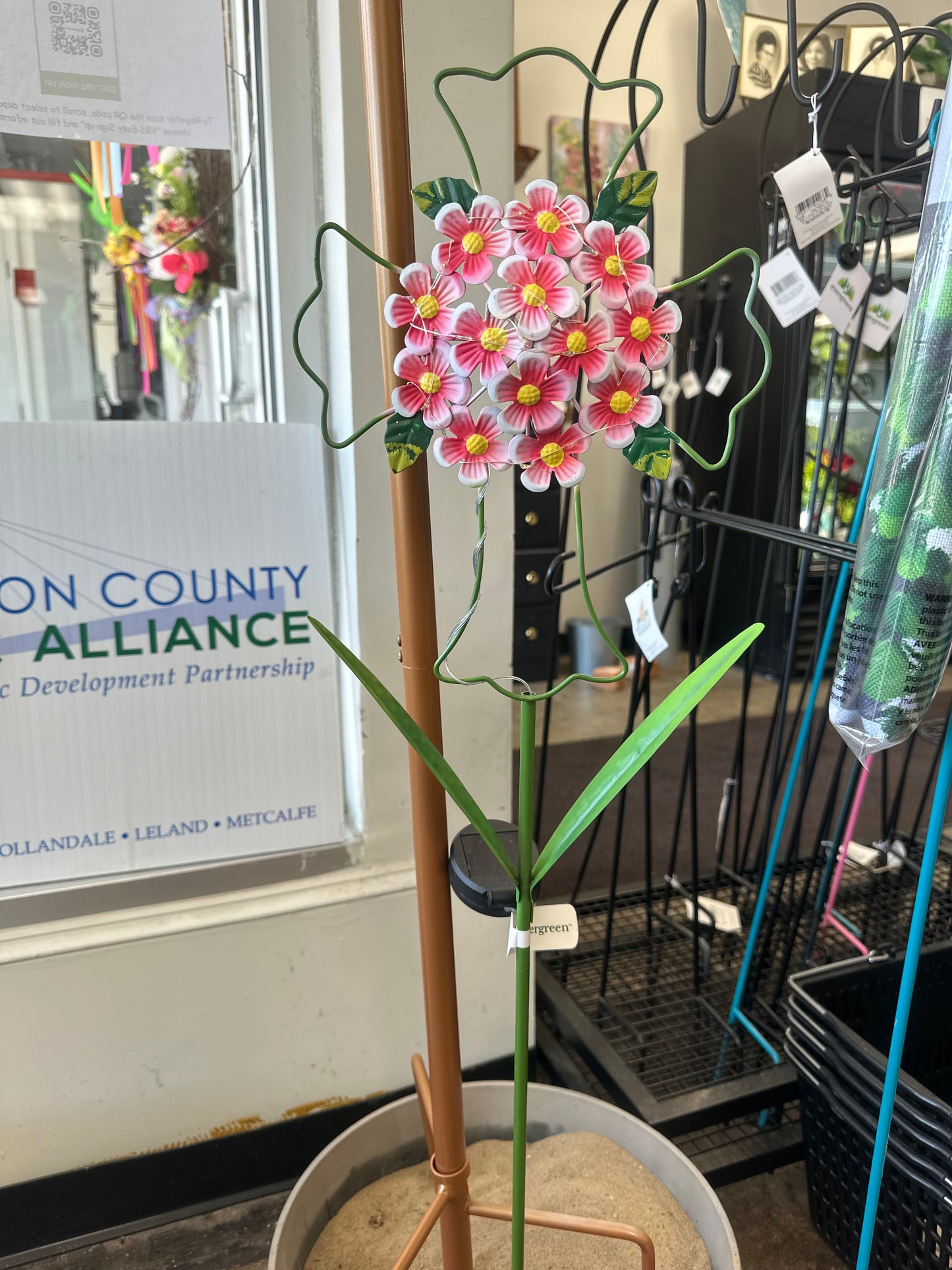 Evergreen flower cross outside stand